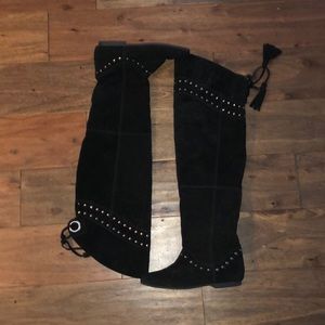 Black knee-high faux suede boots.